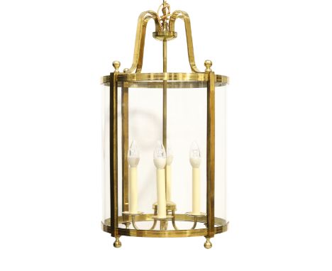 A Continental brass hall lantern, third quarter 20th century, of cylindrical form with glazed panels and spherical finials, 7
