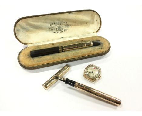 A vintage 9 carat gold hallmarked Waterman's Ideal fountain pen with a 9 carat gold banded cap together with a 9 carat gold c