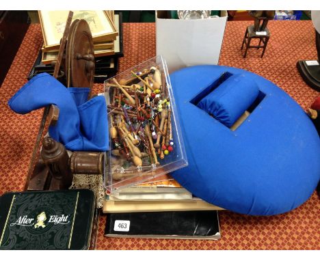 A vintage bobbin winder together with a lace maker's pillow, box of bobbins and other lace making related items.