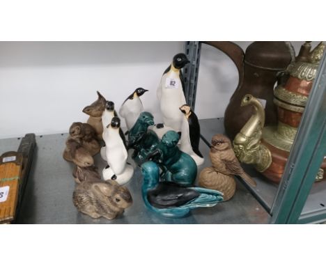 A collection of various Poole Pottery animal and bird ornaments (examine).