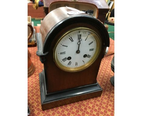 An early 20th century mahogany cased dome topped mantle clock.