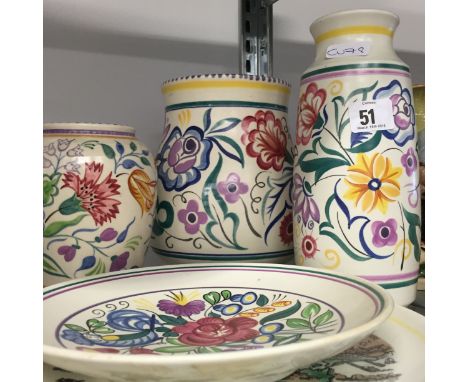 Five various white bodied Poole Pottery items.