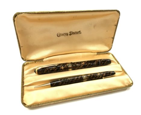 A vintage Conway Stewart 58 Tiger Eye set to include a Conway Stewart No. 33 pencil in an original Champagne silk inlaid box.