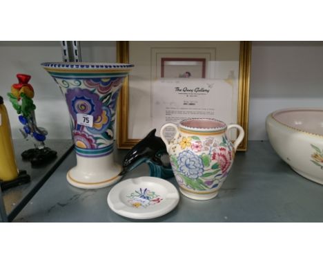 A Poole Pottery flared vase decorated in the HE pattern together with a small twin handled vase, ashtray and dolphin.