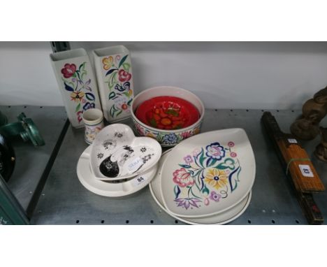 A collection of various white bodied and other Poole Pottery.