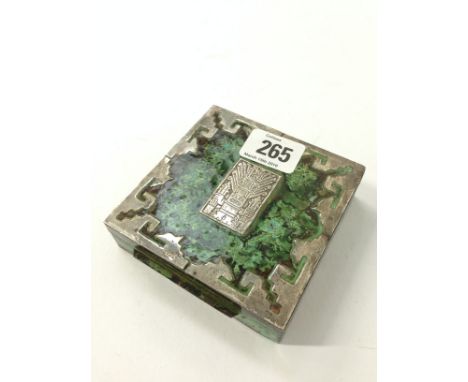 A South American silver and enamel square shaped cigarette box, the centre mount decorated with an Aztec style Male Totem.