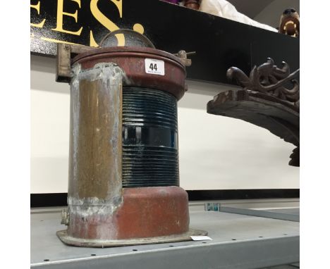 A brass and copper ship's lamp.