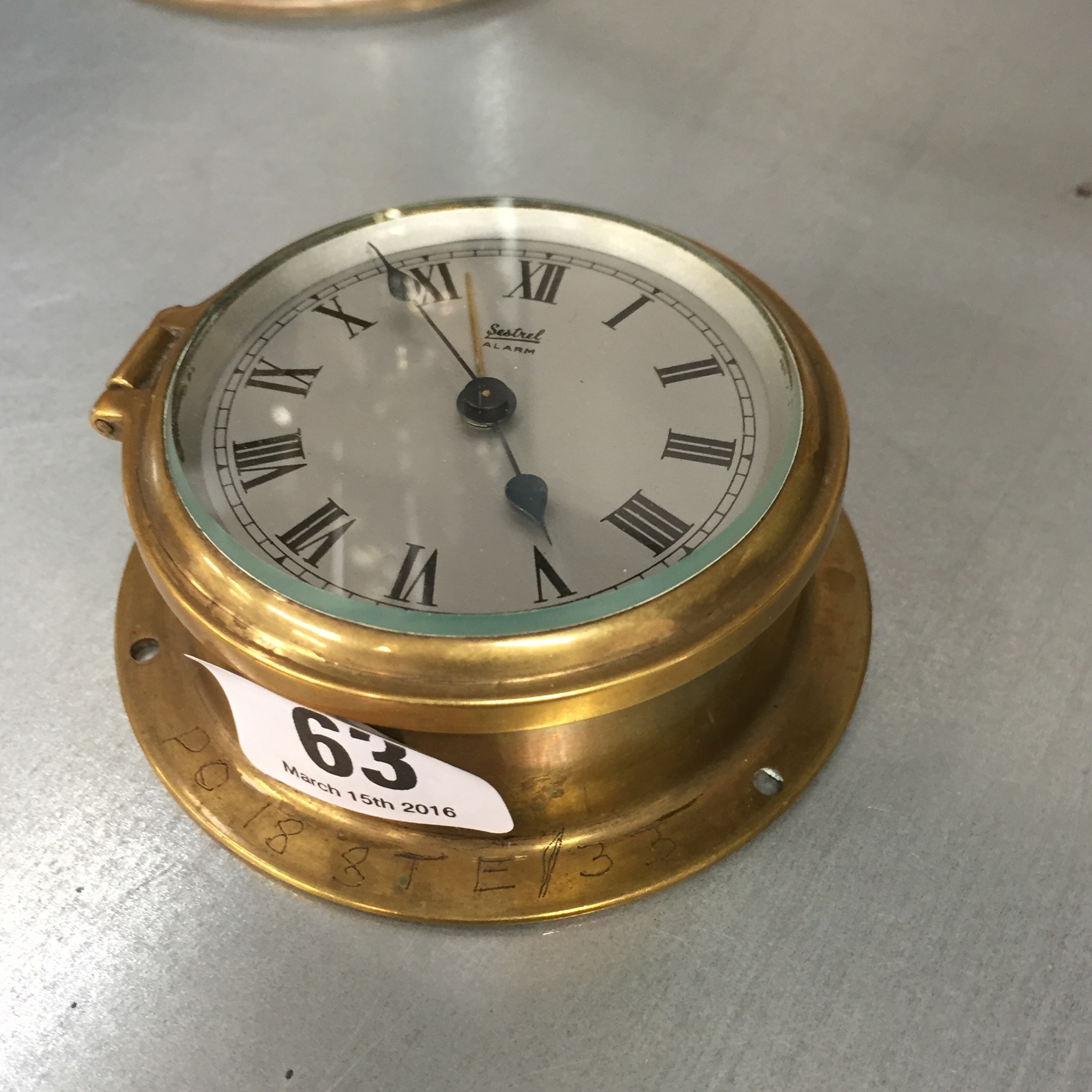 A small Sestrel brass cased alarm clock.