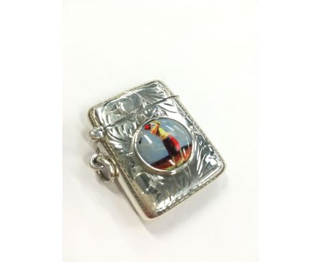 A silver and enamel effect Vesta case decorated with a Golfer.