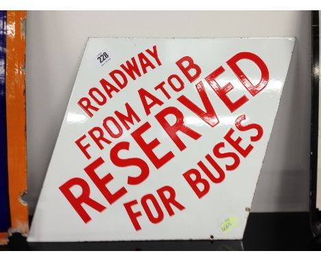 A diamond shape enamel Bus sign: Roadway From A To B Reserved For Buses.