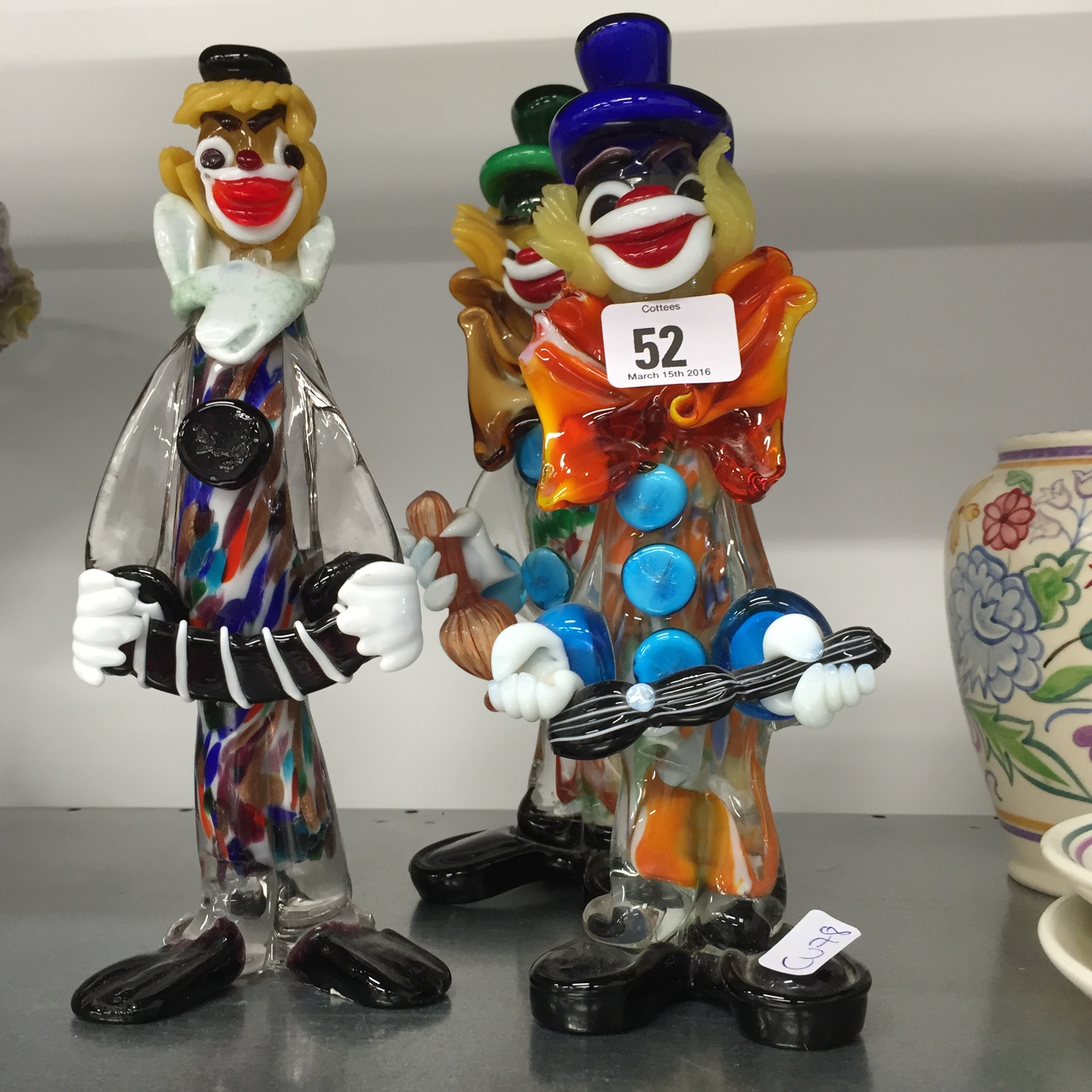 Three Murano glass clown ornaments.