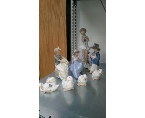 Four various Nao china ornaments modelled as Children together with four Duck ornaments.