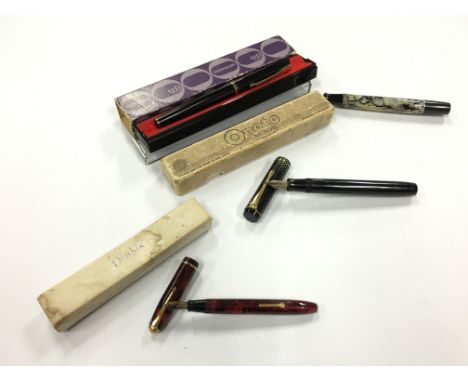 Three vintage boxed fountain pens to include a Conway Dinky 550, Onoto Minor with a transparent barrel and cap with gold trim