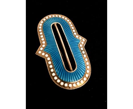 A Marius Hammer enamel buckle.