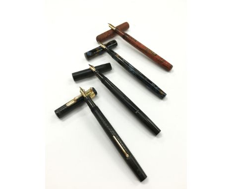 Four vintage fountain pens to include three Swans, one with a 9 carat hallmarked band together with a Conway Stewart red ripp