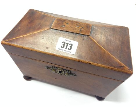 A 19th century sarcophagus shape mahogany tea caddy with fitted interior. 