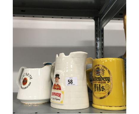 Seven various china pub Whisky jugs and tankards.