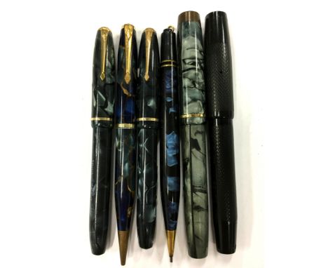 A selection of vintage Conway Stewart fountain pens and pencils to include Conway Dinkies and a blue cracked style Dandy.
