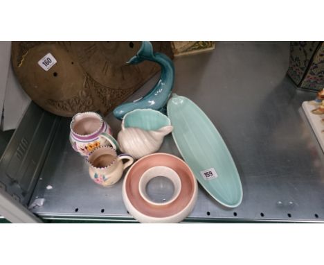 Six various Poole Pottery items.