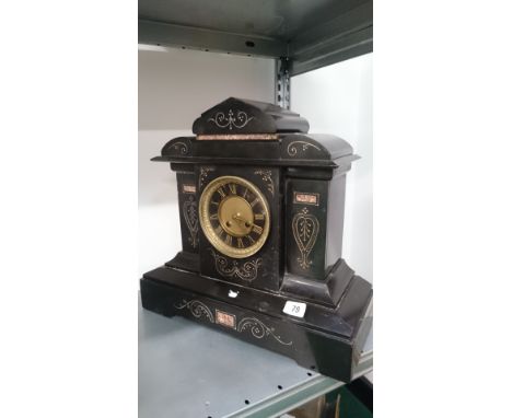 A late 19th century black slate mantle clock.