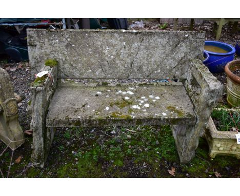 A WEATHERED COMPOSITE TREE TRUNK EFFECT GARDEN BENCH, that dismantles into four pieces, length 129cm x depth 59cm x height 87