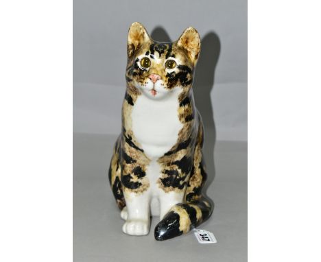 A WINSTANLEY TABBY AND WHITE CAT, no 5, in seated pose, having pale amber glass eyes, signed and numbered to base, height (1)