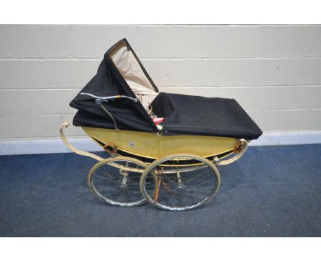 A VINTAGE MANTON CREAM FINISH PRAM (condition:-distressed and broken straps