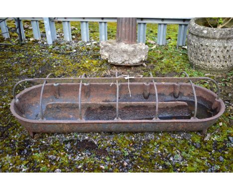 A VINTAGE WEATHERED CAST IRON FEEDING TROUGH, length 91cm