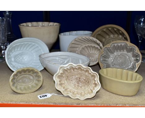 TEN CERAMIC JELLY MOULDS, of varied sizes and designs, to include late Victorian/Edwardian and later examples, designs includ