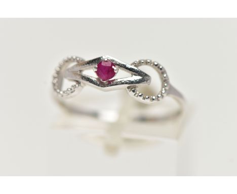 A 9CT WHITE GOLD RUBY RING, designed with a claw set, circular cut ruby, in an openwork mount leading onto a polished thin ba