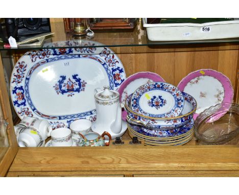 A GROUP OF MINTONS LATE 19TH CENTURY DINNER WARE,  pattern number 8667 blue and red floral border with a foliate centre, comp