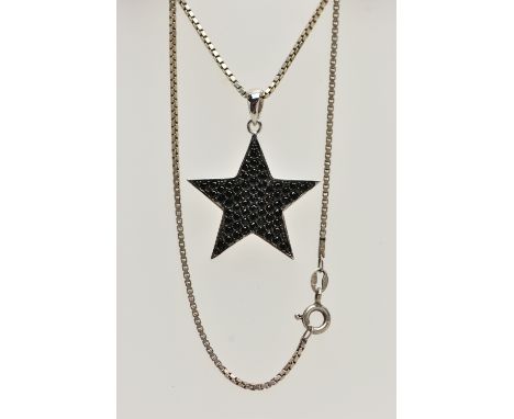 A WHITE METAL BLACK CUBIC ZIRCONIA SET PENDANT NECKLACE, the star pendant pave set with circular cut black cubic zirconia, st