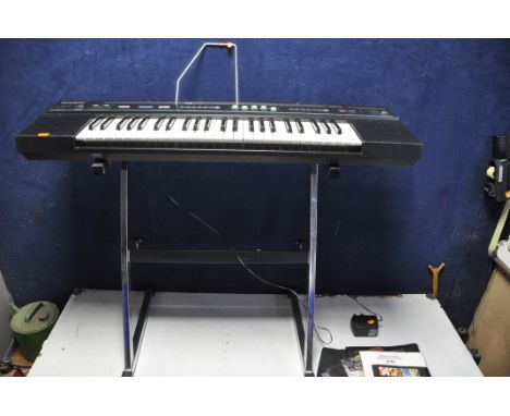 A CASIOTONE CT-450 ELECTRIC KEYBOARD with stand and some music books (PAT pass and working) (Issues to power button)
