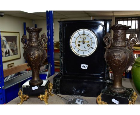 A BLACK SLATE AND MARBLE CASED CLOCK GARNITURE, having brocot escapement, white chapter ring with black Roman numerals, the b
