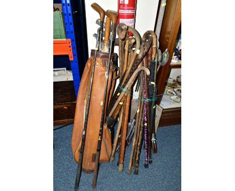 A LARGE QUANTITY OF WALKING STICKS AND A SET VINTAGE GOLF CLUBS, to include a set of Dunlop 'Arnold Palmer' Power Point golf 