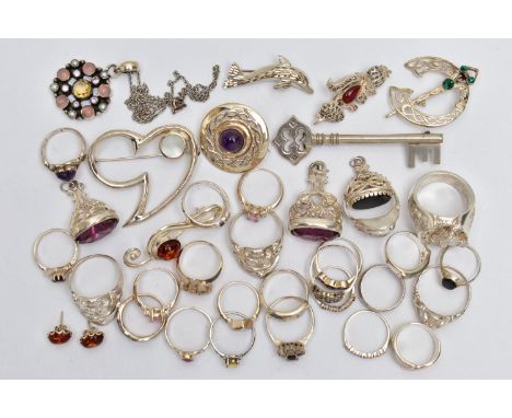AN ASSORTMENT OF WHITE METAL JEWELLERY, to include three white metal fobs, an assortment of rings, brooches, earrings and a p