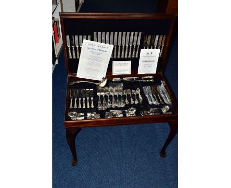 A LARGE TABLE CANTEEN, a twelve place 'Sheffield Cutlery' stainless steel canteen set, including a carving set, ladle, fish e