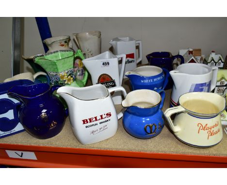 A COLLECTION OF TEN BREWERIANA WATER JUGS TOGETHER WITH COALPORT COTTAGES, comprising a Wade's 'Worthington E' jug, Wade's 'G