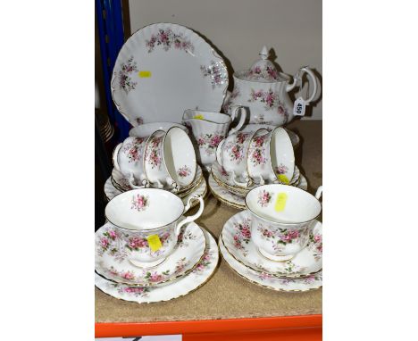 A ROYAL ALBERT 'LAVENDER ROSE' PATTERN TEA SET,  comprising two fruit dishes (marked as second quality), teapot, milk jug, su