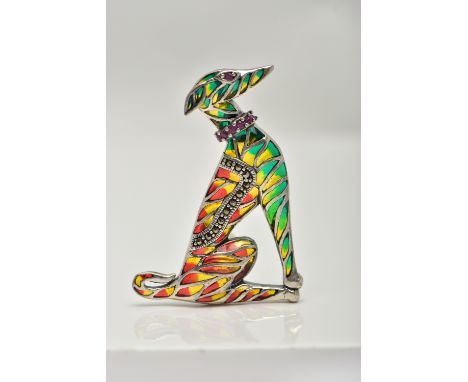 A WHITE METAL PLIQUE A JOUR BROOCH, in the form of a seated dog, decorated with red, green and yellow enamel, with marcasite 