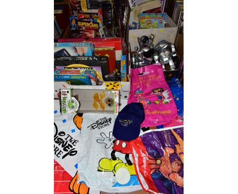 FOUR BOXES OF TOYS AND GAMES ETC, to include battery operated robots, diecast vehicles including a boxed Corgi Casino Royal c