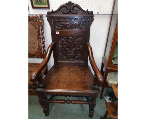 Victorian Wainscot Chair with carved fish and foliate panel back, scroll arms, supported on turned stretchers Condition - Spl