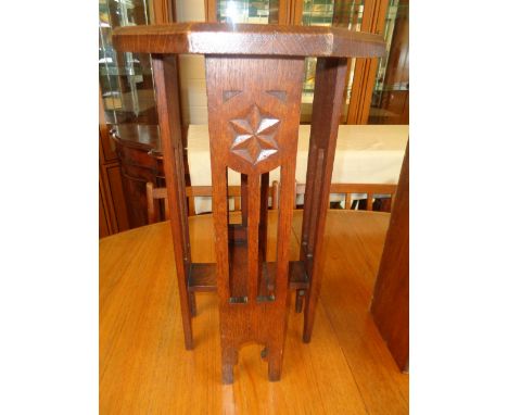 Oak Carved Octagonal side table supported on 4 panel sides with pierced decoration, Height 52cm Condition - Good Overall