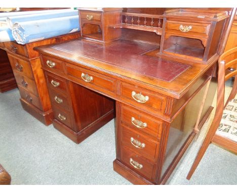 Victorian Walnut desk, raised superstructure with spindle gallery, drawers and a shelf, the base with rectangular top and mou