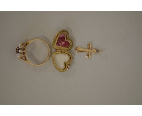 A 9ct gold heart shaped locket, 2.6g; together with a 14K gold cross, 0.8g; and an amethyst and pearl ring. (3) 