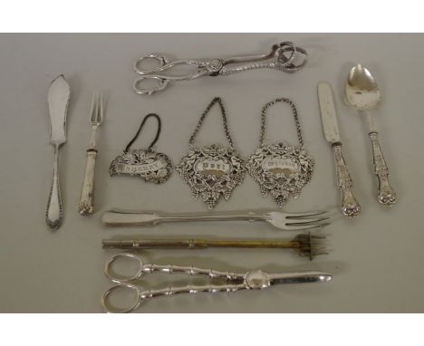 A small quantity of silver and silver plated items, to include a pair of grape scissors; a pair of tongs; and three decanter 