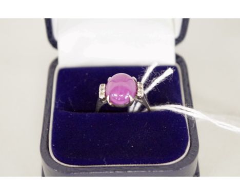 A star ruby and diamond ring,&nbsp;stamped 950. 