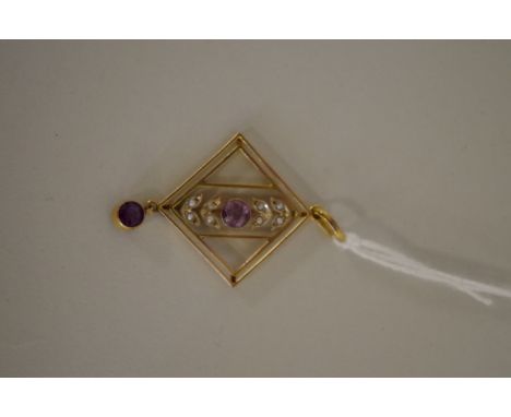 An Edwardian 9ct gold amethyst and seed pearl pendant. 