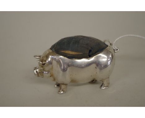 An Edwardian&nbsp;silver pig pin cushion,&nbsp;by Levi &amp; Salaman, Birmingham 1903, 5.5cm x 3cm. 