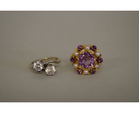 A 9ct white gold and platinum two stone white sapphire ring; together with a 9ct gold amethyst and pearl dress ring. (2). 